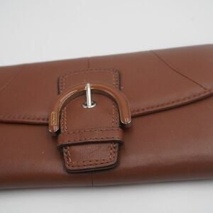 Coach Wallet in Chestnut belt style Buckle Closure sleek elegant design